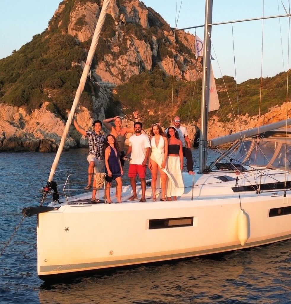Travelers enjoying a group adventure on a sailboat